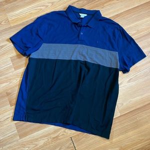 Men’s polo by Calvin Klein is color locked in navy, grey and black